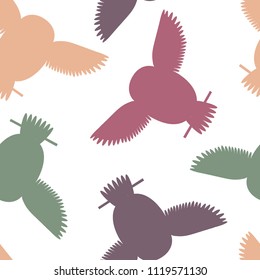 Seamless vector pattern with grey, red, pink and purple owls. Repetitive background with vector flat multicolored birds. Owls in the repetitive seamless vector pattern.