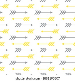 Seamless vector pattern of grey and yellow arrows on a white background.