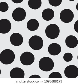 Seamless vector pattern of hand drawn polka dots, random spots in various sizes. Big and small dark circles in black and white. Stylish monochrome abstract background. Simple retro design elements.