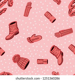 Seamless vector pattern with hand drawn hat with a pompom, scarf, mittens and shoes with knitted cuffs. Set knitted seasonal winter traditional accessories with ornament vector illustration