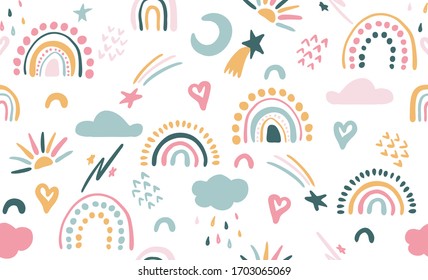 Seamless vector pattern with hand drawn rainbows and sun. Trendy baby texture for fabric, textile, wallpaper, apparel, wrapping