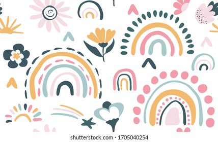 Seamless vector pattern with hand drawn rainbows and sun Trendy baby texture for fabric textile wallpaper apparel wrapping
