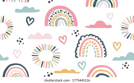 Seamless vector pattern with hand drawn rainbows and sun Trendy baby texture for fabric textile wallpaper apparel wrapping