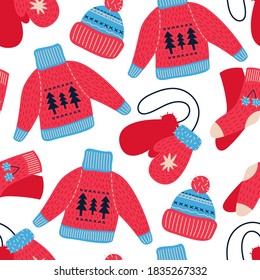 Seamless vector pattern with hand drawn knitted clothes. Christmas illustration