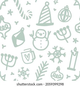 Seamless vector pattern with hand drawn christmas cute illustrations such as snowflakes, berries, candles, cup of tea, candy cane, christmas tree decorations, snowman. Good for gift wrapping paper. 