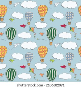Seamless vector pattern, hand drawn hot air baloons flying in the blue sky, pattern for backgrounds, wrapping paper, fabrics and other designs