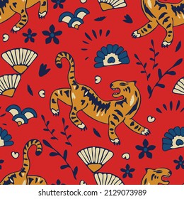 Seamless vector pattern with hand drawn tiger on red background. Chines year animal wallpaper design. Decorative traditional fashion textile.