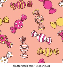 Seamless vector pattern with hand drawn sweets on pink background. Simple candy wrapper wallpaper design. Decorative cartoon treat fashion textile.