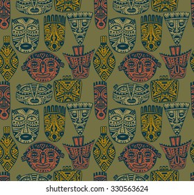 Seamless vector pattern with hand drawn fancy masks in african style. Colorful tribal ethnic endless background.