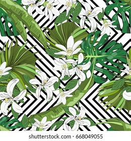 Seamless vector pattern of hand drawn flowers and leaves. Tropical background.