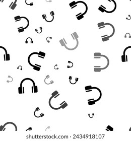 Seamless vector pattern with headphones symbols, creating a creative monochrome background with rotated elements. Vector illustration on white background