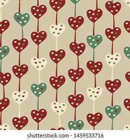 A seamless vector pattern with heart shaped lillipops in retro colors. surface print design.