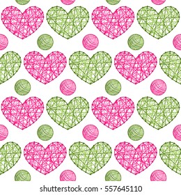 Seamless vector pattern with hearts and balls of yarn.