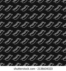 Seamless vector pattern with hot dogs. Doodle vector with hot dogs icons on black background.