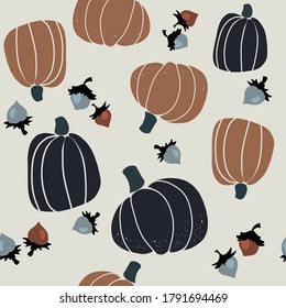 Seamless vector pattern with the image of autumn leaves, pumkins, nuts stylized in a flat style, Cozy and cute. Trendy colors of the autumn are perfect for scrapbooking paper, textile, fabric, card