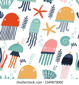 Seamless vector pattern with jellyfishes and seastars. Cute texture for fabric, wrapping, textile, wallpaper, apparel.  Vector illustration childish background