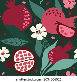 Seamless vector pattern with juicy and bright pomegranates on a  green  background. For wallpaper, wrapping paper, textiles, postcards, web page backgrounds, interior decor, menus. Cartoon design.