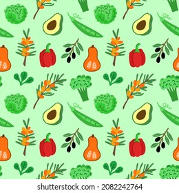 Seamless vector pattern with juicy summer vegetables from your own garden on a green background