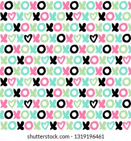 Seamless vector pattern with letter xoxo and hearts. Hand drawn letters background.