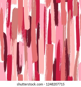 Seamless vector pattern made by hand drawn paint strokes. Red shades wallpaper. Cosmetics smudges.

