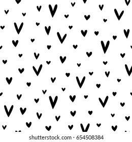 Seamless vector pattern made of simple black hearts on white background.