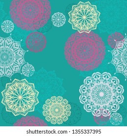 Seamless vector pattern with mandalas on a turquoise background
