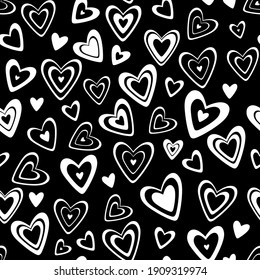 Seamless vector pattern. Many different black with white hearts in a scatter isolated on a transparent background with a black substrate.