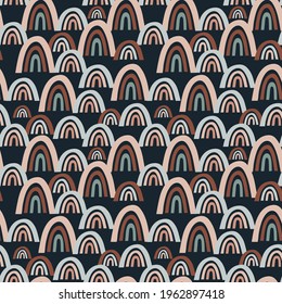 seamless vector pattern with multicolored abstract rainbows on a blue background, for childrens and modern designs