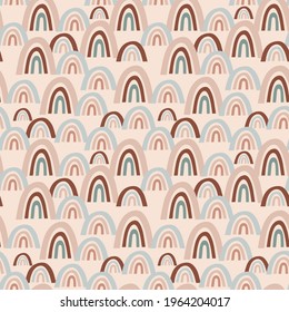 seamless vector pattern with multicolored abstract rainbows on a beige background, for childrens and modern designs