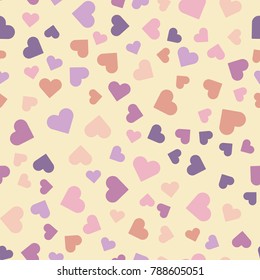 Seamless vector pattern with multi-colored hearts in pastel colors.