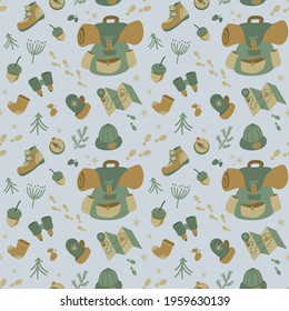 Seamless vector pattern on the theme of tourism  trips light brown and green colors on a pastel blue background, includes the basic elements necessary equipment and clothing, plant elements.