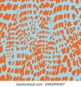 Seamless vector pattern with orange abstract ornament on blue background.