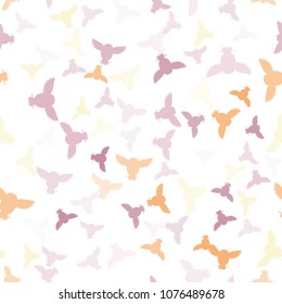 Seamless vector pattern with orange, pink, yellow, violet owls. Repetitive background with vector flat birds different colors. Owls in the repetitive seamless vector pattern.
