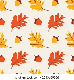 Seamless vector pattern of orange and yellow oak leaves and acorns on a gray background. Colorful autumn illustration for gift paper, packaging, textiles, wallpaper, etc.