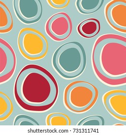 Seamless vector pattern with ovals in retro colors.