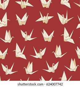 Seamless vector pattern with paper cranes. Origami bird figures on red background