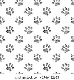 Seamless vector pattern with paws on a white isolated background.