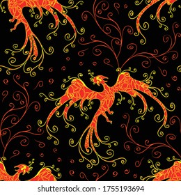 Seamless vector pattern with phoenix fire on black background. Mythical bird wallpaper design. Fire bird fashion fabric style.