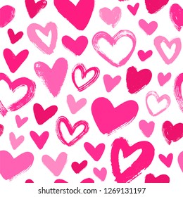 Seamless vector pattern with pink brush strokes hearts. Valentines Day background.