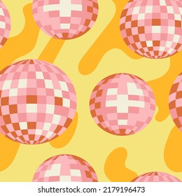 Seamless vector pattern with pink disco balls on wavy yellow background. Party, celebration psychedelic concept. 