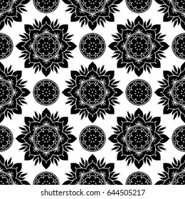 Seamless vector pattern for printing and design in a palette of black and white. Abstract ornament with floral motif