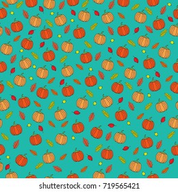 Seamless vector pattern. Pumpkins and leaves autumn pattern on the blue background.