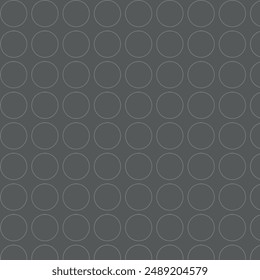 Seamless vector pattern of raised dots on dark grey background. Eps10.
