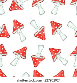 Seamless vector pattern with red fly-agaric mushrooms