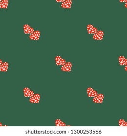 Seamless vector pattern with red hearts with white stars on a green background. Illustration on Valentine's Day. Beautiful tile, wrapper, cover, textile, postcard, wallpaper design.