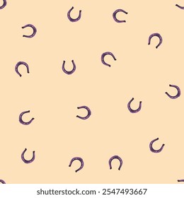 Seamless vector pattern with repeating horseshoes on a beige background, great for fabric, decor, and digital art projects.