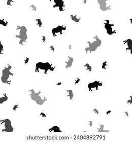 Seamless vector pattern with rhino symbols, creating a creative monochrome background with rotated elements. Vector illustration on white background