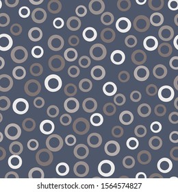 A seamless vector pattern with round rings polka dots in grey colors. Surface print design.