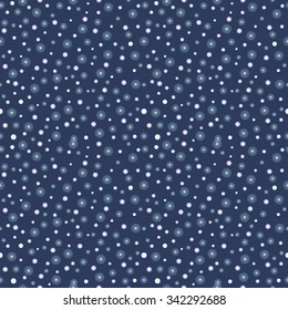 Seamless vector pattern. Seasonal winter  dark blue background with white snowflakes 