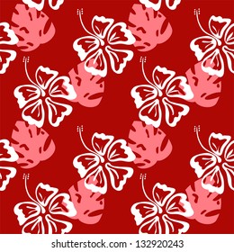 seamless vector pattern of silhouettes of hibiscus flowers and palm leaves on the red background